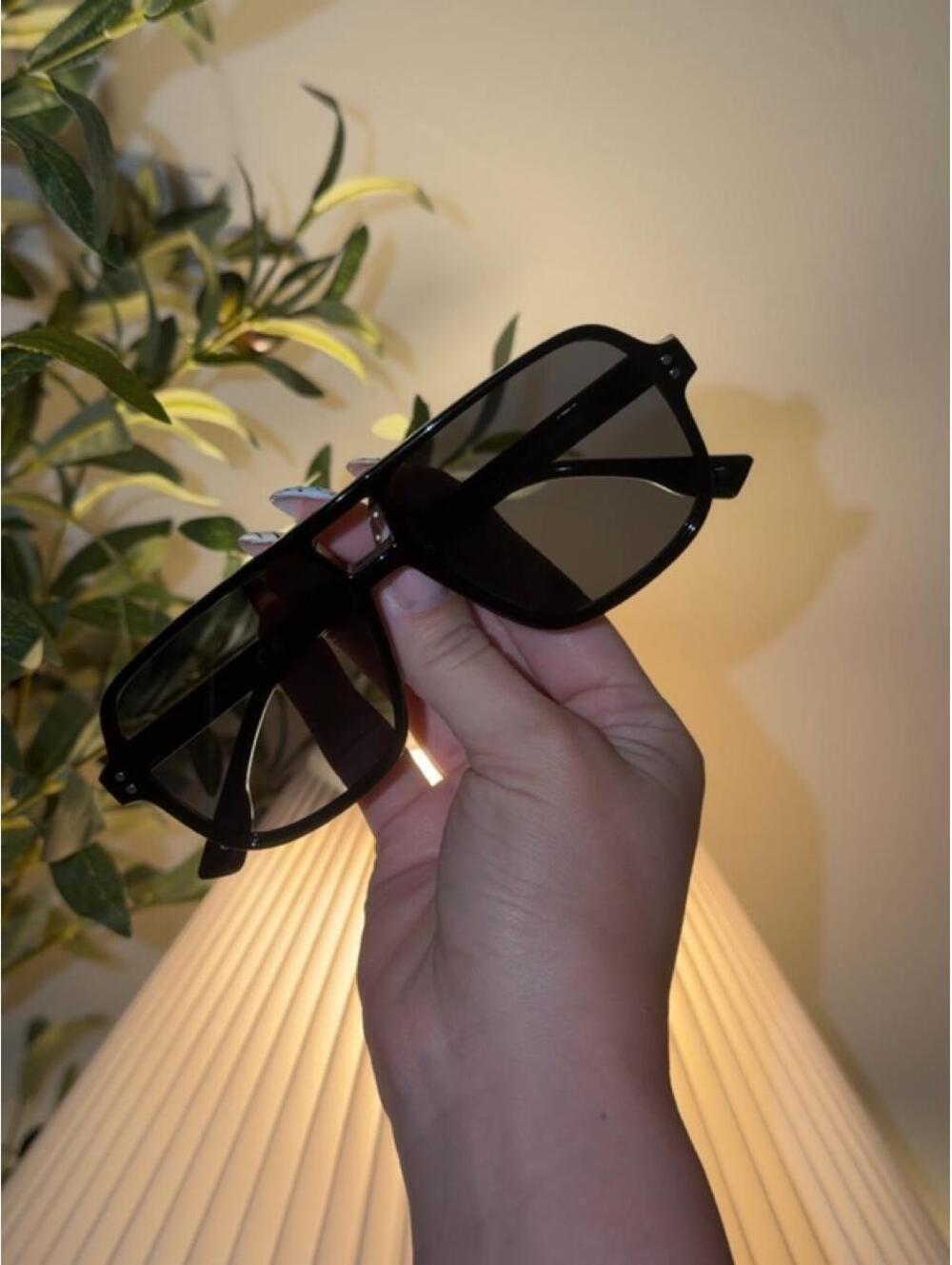 Black aviator sunglasses with a retro vibe